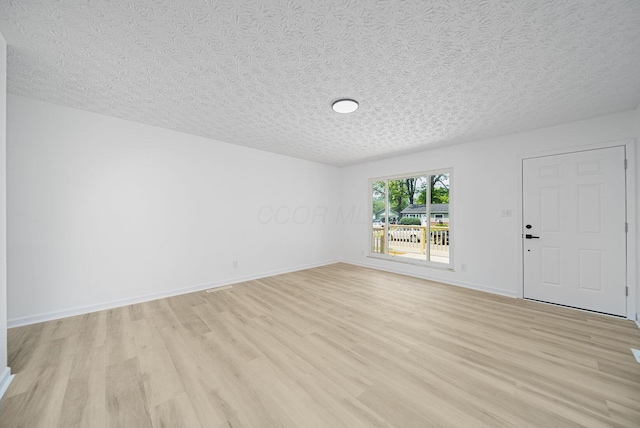1874 Fleming Rd, Columbus, OH 43232 - empty room featuring light wood-type flooring and a textured ceiling