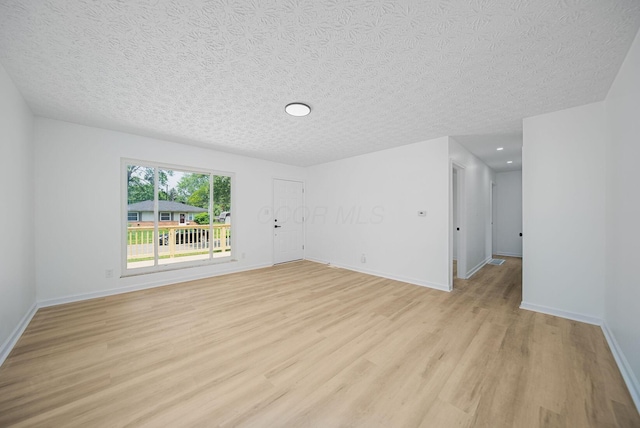 1874 Fleming Rd, Columbus, OH 43232 - unfurnished room featuring light wood-style floors and a textured ceiling