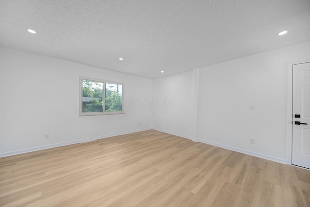 1874 Fleming Rd, Columbus, OH 43232 - empty room featuring light wood-style floors, a textured ceiling, and recessed lighting