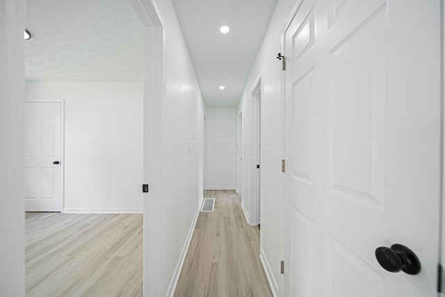 1874 Fleming Rd, Columbus, OH 43232 - hallway featuring light wood-style floors and recessed lighting