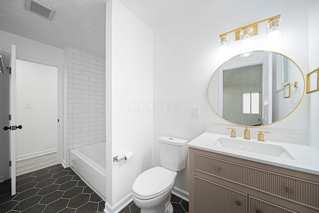 1874 Fleming Rd, Columbus, OH 43232 - full bathroom featuring vanity, tile patterned floors, and a textured ceiling