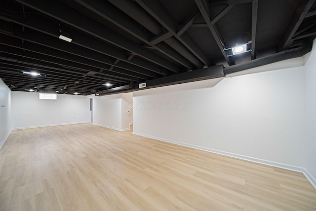1874 Fleming Rd, Columbus, OH 43232 - basement featuring light wood finished floors and stairway