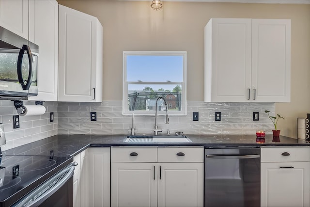 3956 Darby Park Rd, Hilliard, OH 43026 - kitchen with stainless steel appliances, white cabinetry, and backsplash