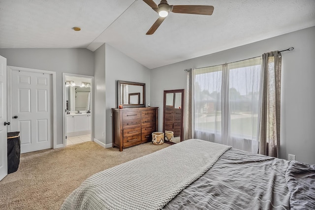 3956 Darby Park Rd, Hilliard, OH 43026 - bedroom with light colored carpet, vaulted ceiling, ensuite bathroom, and ceiling fan