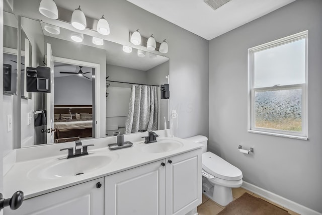 3956 Darby Park Rd, Hilliard, OH 43026 - ensuite bathroom with ceiling fan, double vanity, tile patterned flooring, and curtained shower