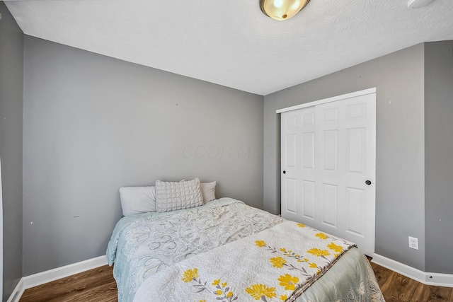 3956 Darby Park Rd, Hilliard, OH 43026 - bedroom with dark wood-type flooring and a closet
