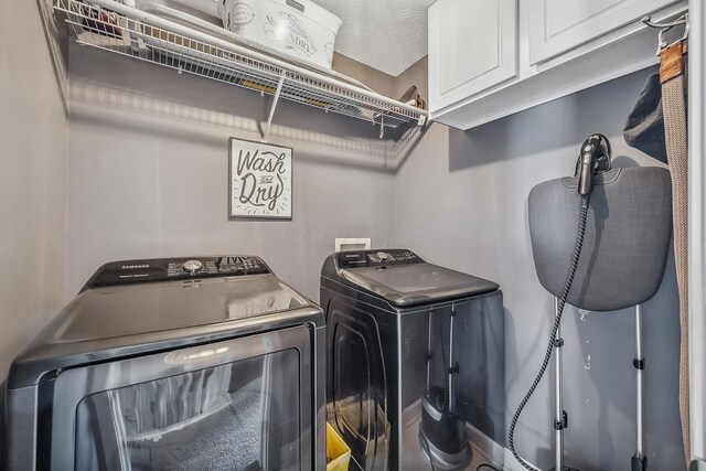 3956 Darby Park Rd, Hilliard, OH 43026 - laundry room featuring washing machine and clothes dryer and cabinet space