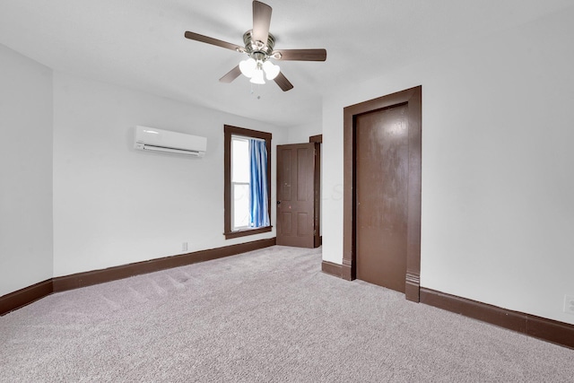 115 E Main St, Mount Sterling, OH 43143 - unfurnished bedroom featuring a wall mounted AC, carpet floors, a ceiling fan, and a closet