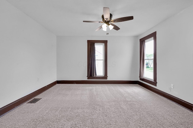 115 E Main St, Mount Sterling, OH 43143 - carpeted spare room with baseboards and a ceiling fan