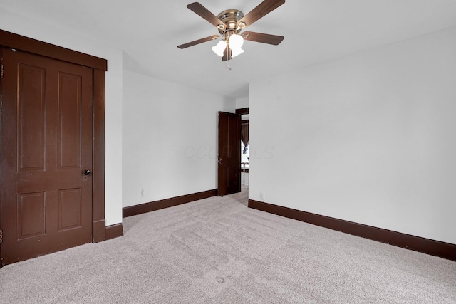 115 E Main St, Mount Sterling, OH 43143 - empty room with carpet flooring and a ceiling fan