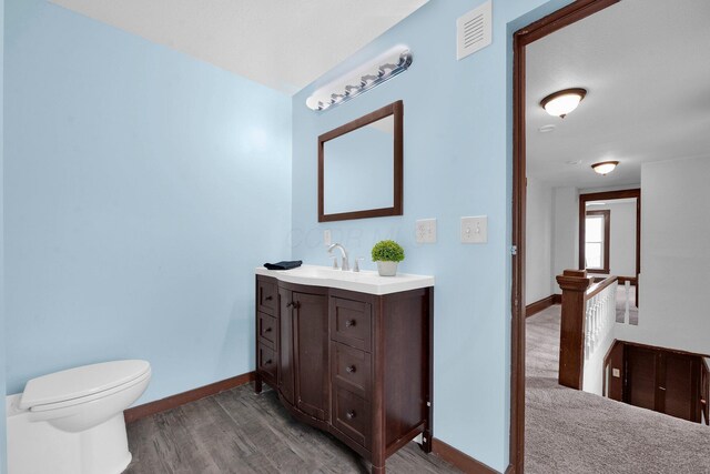 115 E Main St, Mount Sterling, OH 43143 - bathroom with wood finished floors and vanity