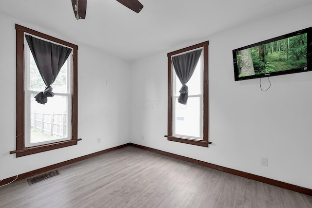 115 E Main St, Mount Sterling, OH 43143 - empty room featuring wood finished floors and ceiling fan
