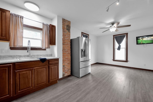 115 E Main St, Mount Sterling, OH 43143 - kitchen with stainless steel refrigerator with ice dispenser, light countertops, light wood-type flooring, and ceiling fan