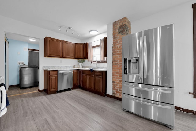 115 E Main St, Mount Sterling, OH 43143 - kitchen featuring stainless steel appliances, light countertops, and light wood finished floors