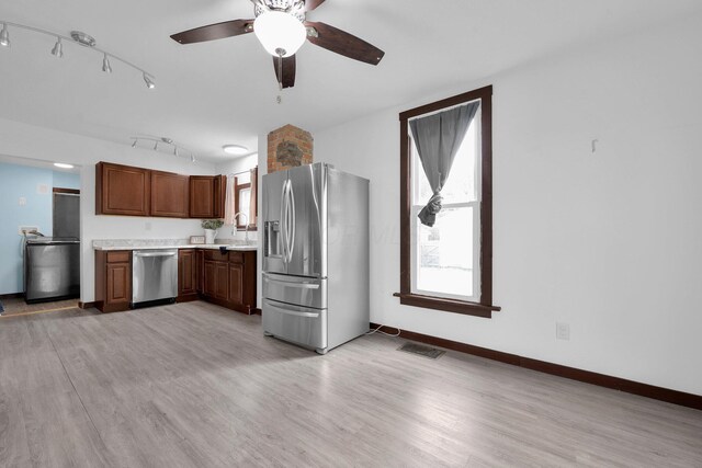 115 E Main St, Mount Sterling, OH 43143 - kitchen with appliances with stainless steel finishes, light countertops, light wood finished floors, and a ceiling fan