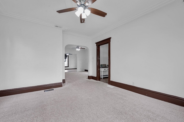 115 E Main St, Mount Sterling, OH 43143 - unfurnished room featuring a ceiling fan, carpet floors, ornamental molding, and arched walkways