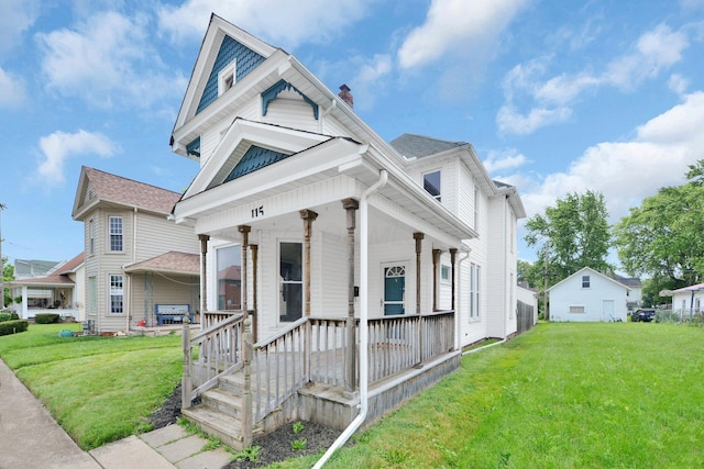 115 E Main St, Mount Sterling, OH 43143 - view of front of house featuring covered porch, a front lawn, and a chimney