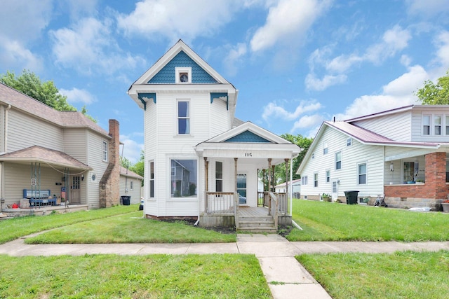 115 E Main St, Mount Sterling, OH 43143 - victorian-style house featuring a porch and a front lawn
