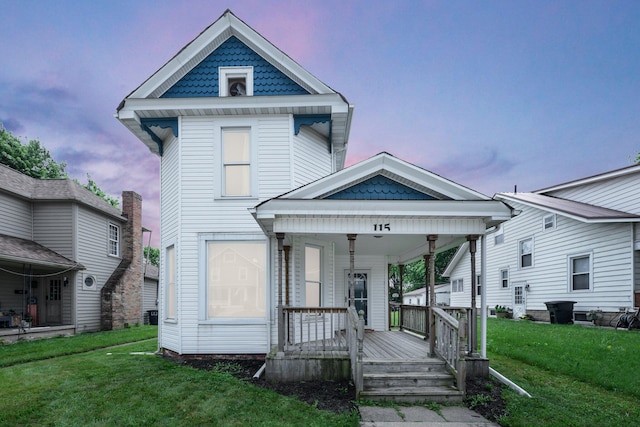 115 E Main St, Mount Sterling, OH 43143 - victorian house with a porch and a lawn