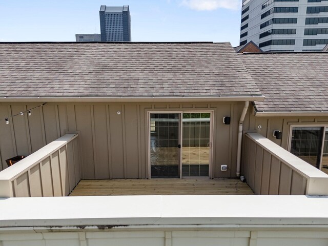 91 W Town St, Columbus, OH 43215 - entrance to property featuring board and batten siding and a shingled roof
