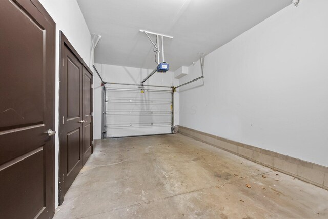 91 W Town St, Columbus, OH 43215 - garage featuring a garage door opener
