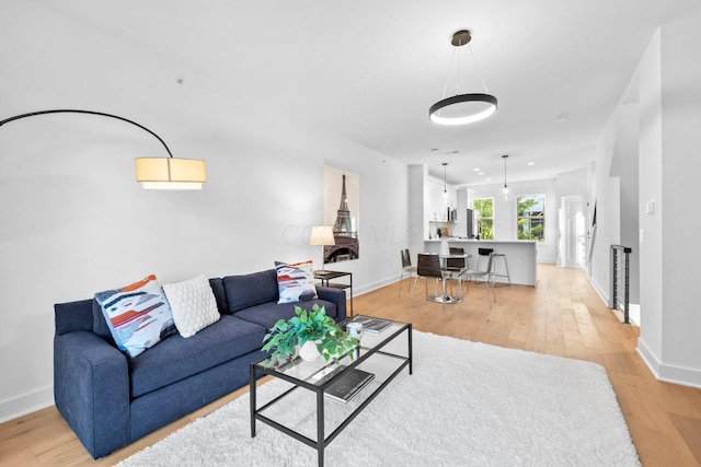 91 W Town St, Columbus, OH 43215 - living area featuring light wood-style flooring and baseboards