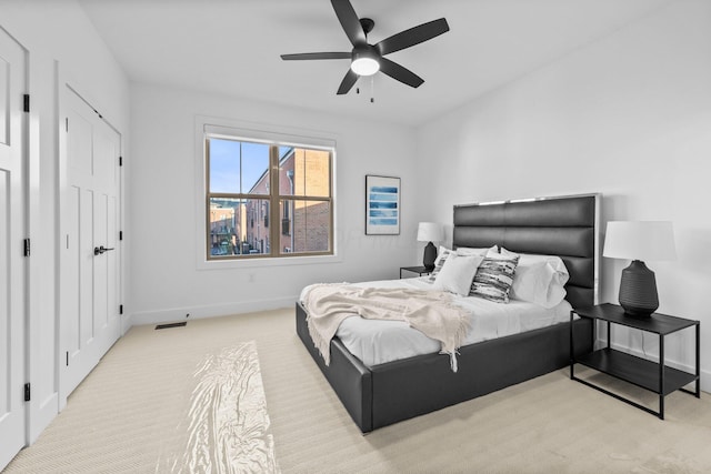 91 W Town St, Columbus, OH 43215 - carpeted bedroom with baseboards and ceiling fan