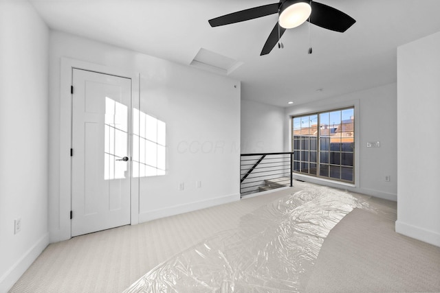 91 W Town St, Columbus, OH 43215 - carpeted spare room featuring attic access and a ceiling fan