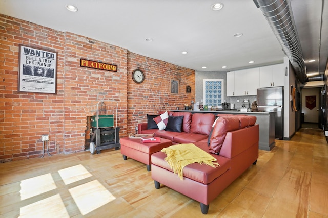 974 N High St Unit B, Columbus, OH 43201 - living room featuring light wood-style floors, recessed lighting, and brick wall