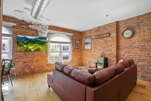 974 N High St Unit B, Columbus, OH 43201 - living area featuring wood-type flooring and brick wall