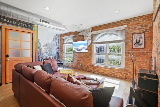 974 N High St Unit B, Columbus, OH 43201 - living room featuring brick wall and wood finished floors