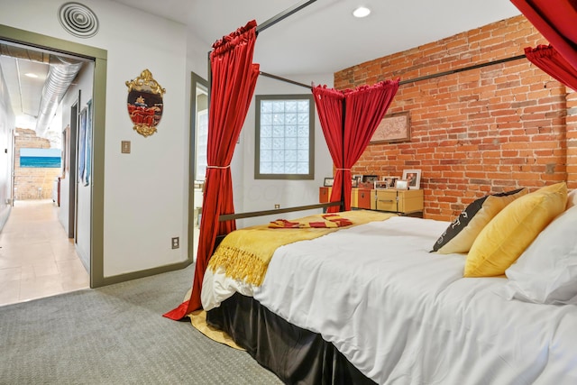 974 N High St Unit B, Columbus, OH 43201 - bedroom with brick wall, access to exterior, recessed lighting, carpet flooring, and an accent wall