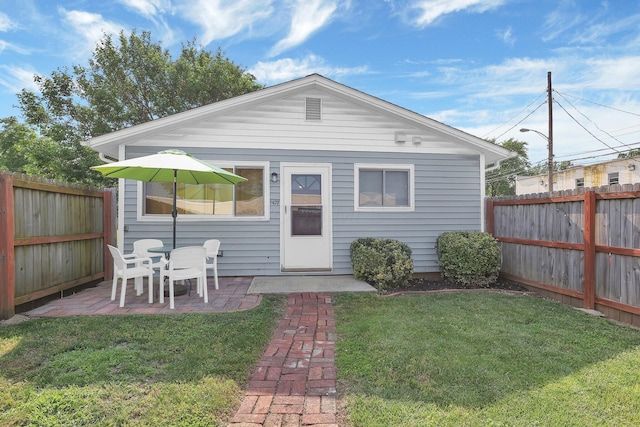 1427 Grogan Ave, Columbus, OH 43211 - back of property with a fenced backyard and a patio area