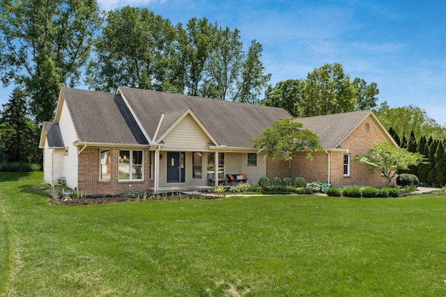 7949 Bluefield St NW, Canal Winchester, OH 43110 - view of front of house with brick siding, a front lawn, and a shingled roof