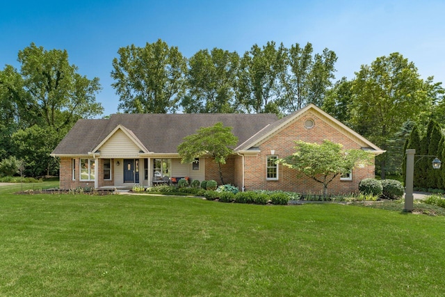 7949 Bluefield St NW, Canal Winchester, OH 43110 - ranch-style house with brick siding, a front lawn, and a porch