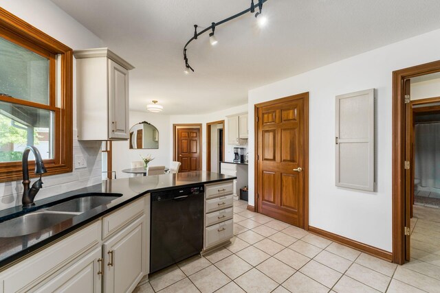 7949 Bluefield St NW, Canal Winchester, OH 43110 - kitchen featuring dishwasher, light tile patterned flooring, and dark countertops