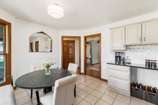 7949 Bluefield St NW, Canal Winchester, OH 43110 - dining area featuring light tile patterned floors and a bar