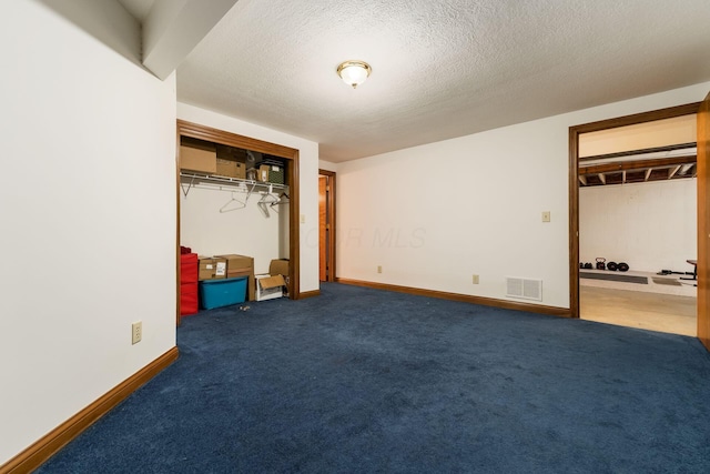 7949 Bluefield St NW, Canal Winchester, OH 43110 - unfurnished bedroom with a closet, a textured ceiling, and carpet floors