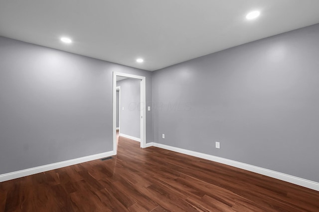172 Jefferson St, Mount Sterling, OH 43143 - empty room with dark wood finished floors and recessed lighting