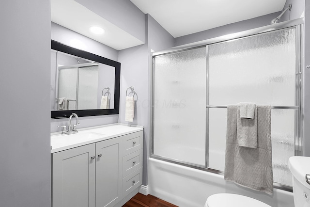 172 Jefferson St, Mount Sterling, OH 43143 - full bathroom with vanity, shower / bath combination with glass door, and wood finished floors
