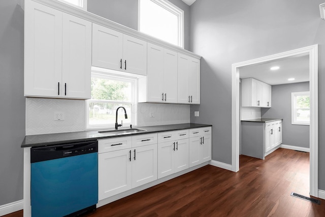 172 Jefferson St, Mount Sterling, OH 43143 - kitchen with dishwasher, healthy amount of natural light, dark wood-style flooring, and dark countertops