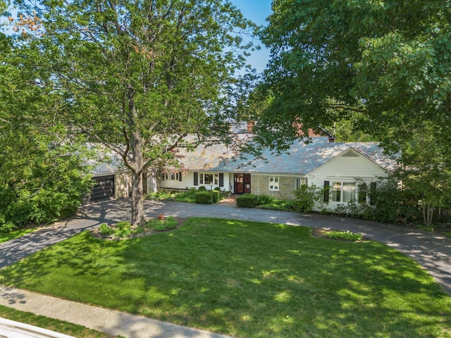 207 Ashbourne Rd, Bexley, OH 43209 - ranch-style home with driveway, a front yard, and an attached garage