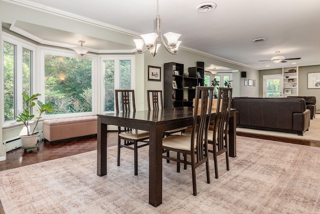 207 Ashbourne Rd, Bexley, OH 43209 - dining room with crown molding, wood finished floors, baseboard heating, a ceiling fan, and a chandelier
