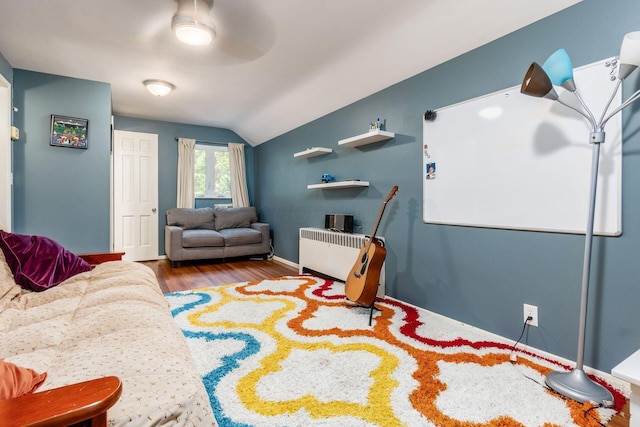 207 Ashbourne Rd, Bexley, OH 43209 - living room featuring lofted ceiling, radiator heating unit, wood finished floors, and ceiling fan