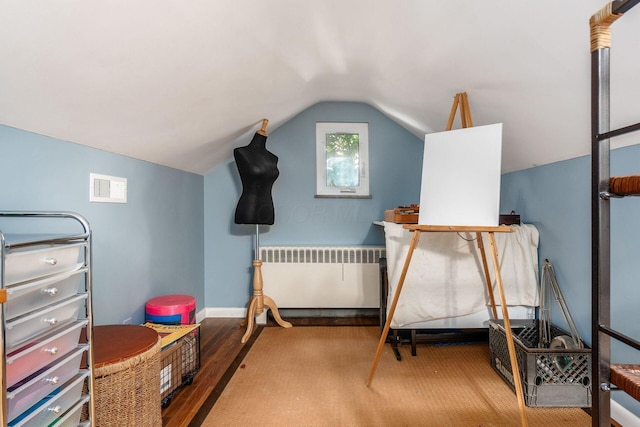 207 Ashbourne Rd, Bexley, OH 43209 - bedroom featuring radiator, wood finished floors, and vaulted ceiling
