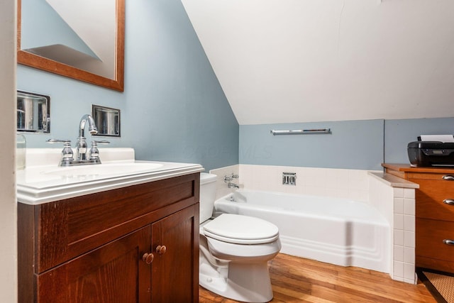 207 Ashbourne Rd, Bexley, OH 43209 - full bathroom with vanity, a bath, wood finished floors, and lofted ceiling