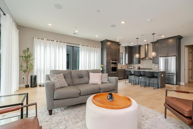 2891 Kobuk Dr Unit 301, Columbus, OH 43228 - living area featuring light wood-style flooring and recessed lighting