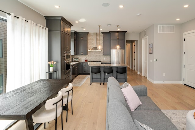 2891 Kobuk Dr Unit 301, Columbus, OH 43228 - living room with light wood finished floors and recessed lighting