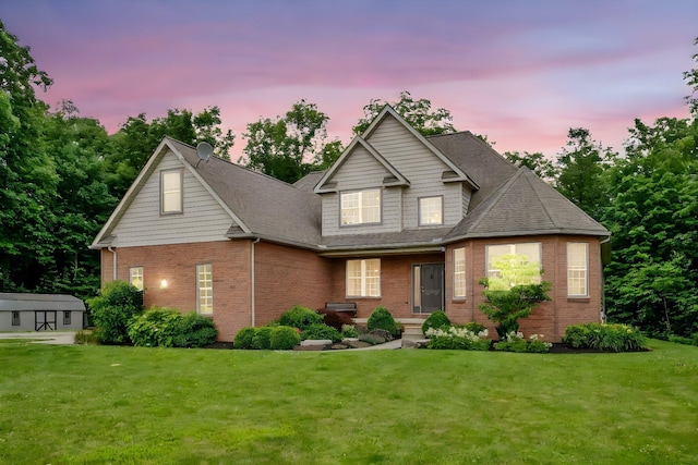1554 Hanover Rd, Delaware, OH 43015 - view of front of house with brick siding, a yard, and a shingled roof