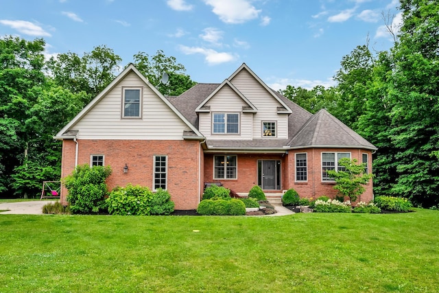 1554 Hanover Rd, Delaware, OH 43015 - traditional home featuring brick siding, a front lawn, and roof with shingles